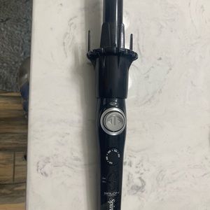 Spin style curling iron